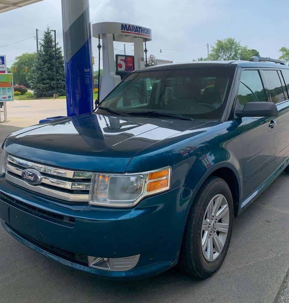 Save money on road trips. Picture of car in front of gas pump